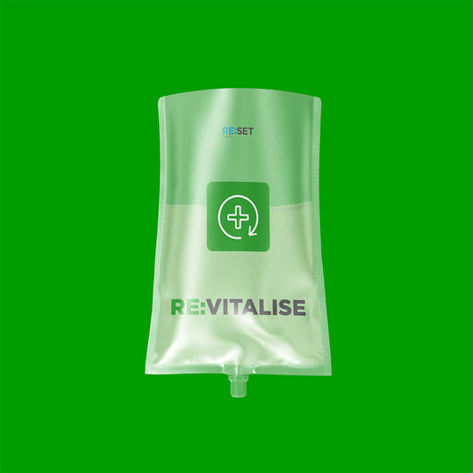 Clear plastic bag with 'REVITALISE' branding on a green background
